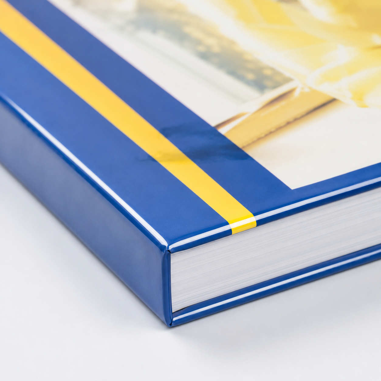 Close-up of the sealed edge and clear glossy finish on a laminated textbook