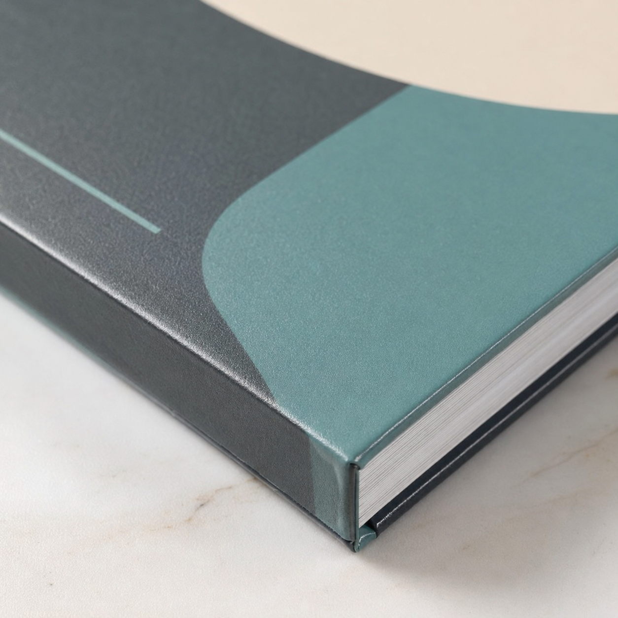 Close-up of the sealed corner and non-reflective finish on a matte laminated textbook